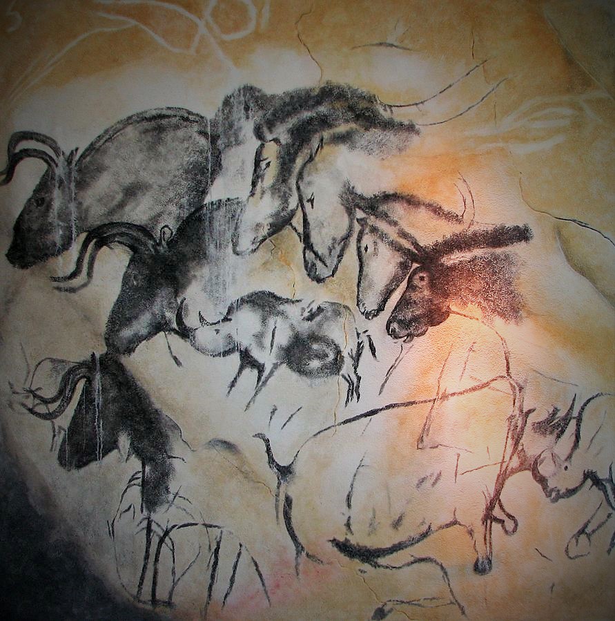 Ancient cave paintings showing animals and figures